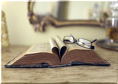 Open Book With Glasses On It