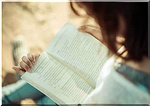 A woman is reading a book