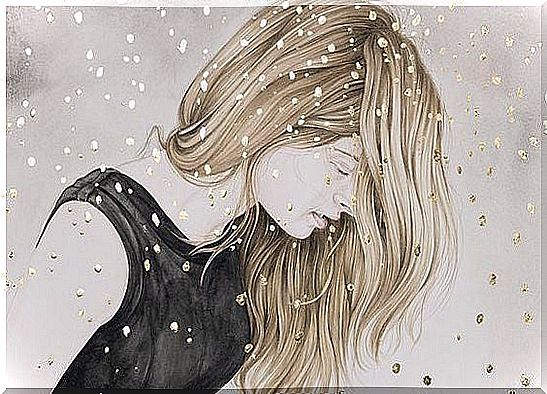 Blonde girl standing in the snow