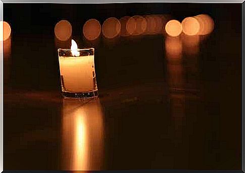 An image of a small candle in a glass