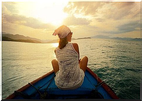 Woman is sailing on a boat