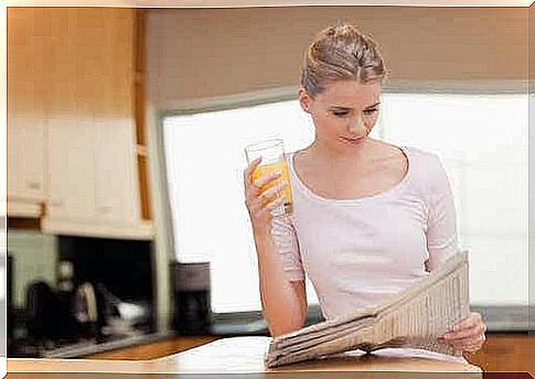 A woman reads the newspaper