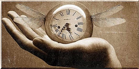 Hand on which clock rests that has wings