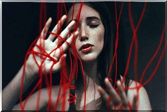 A girl stuck in red threads