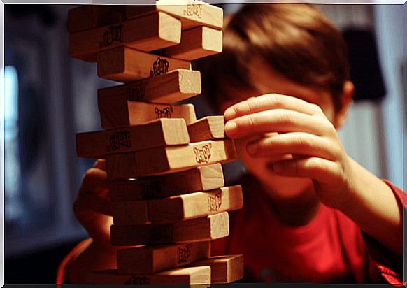 Child playing alone, because people often have a negative image of children with learning disabilities