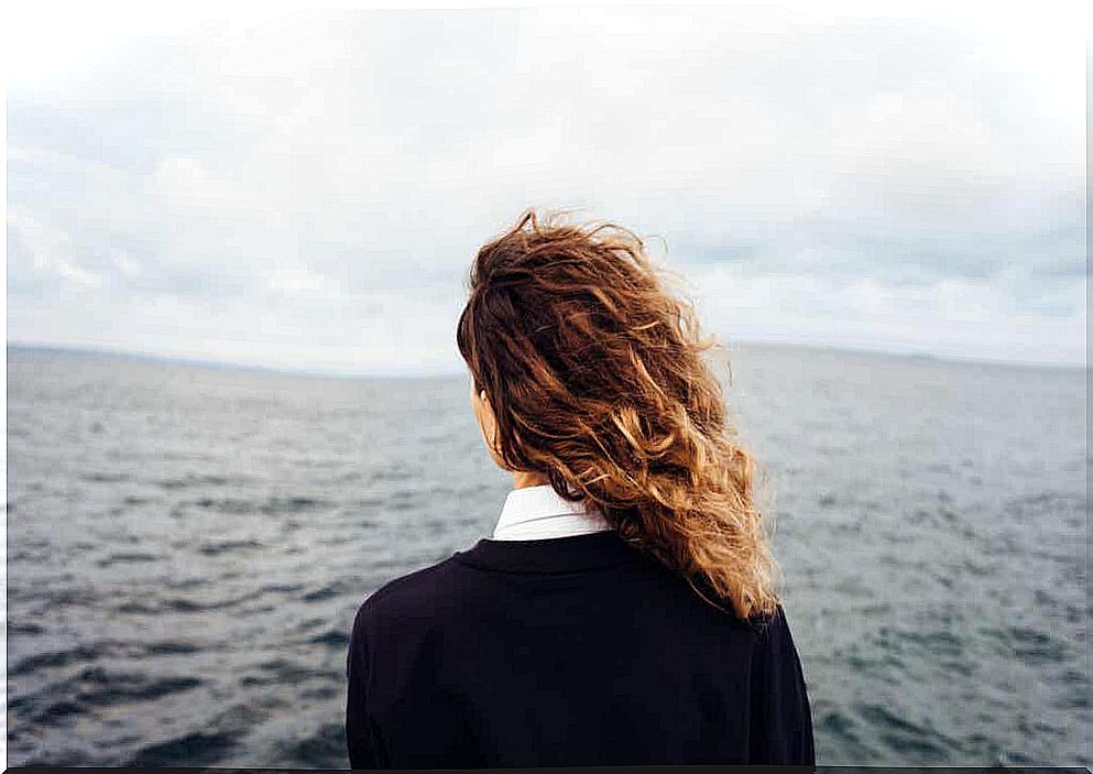 A woman staring at the sea