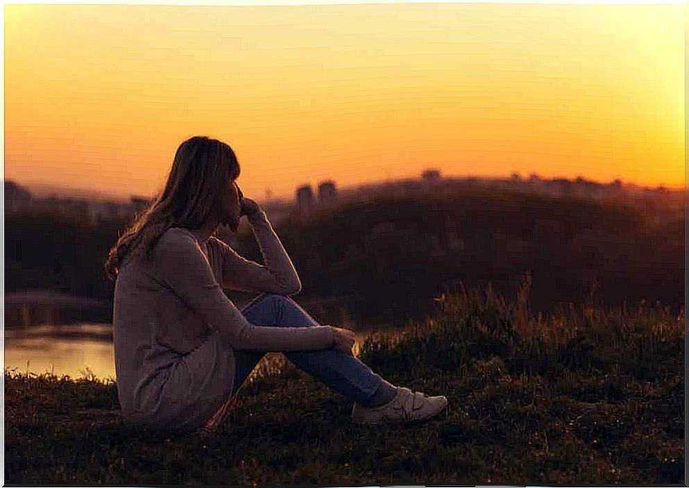 A woman watching the sunset