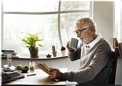 Older man reading a book