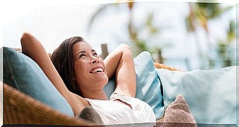 Relaxed woman is lying on the couch